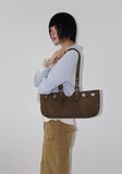 EYELET BELTED STRAP BAG