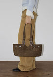 EYELET BELTED STRAP BAG