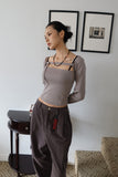 Two-way buckle eyelet tee