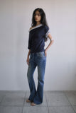 TWISTED BOOTS CUT DENIM JEANS