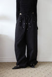 Trimming rivet over pants