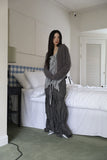 String ribbon over pants