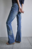 TWISTED BOOTS CUT DENIM JEANS