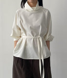 High-neck belted balloon-fit blouse