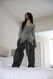 String ribbon over pants