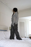 String ribbon over pants