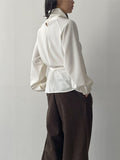High-neck belted balloon-fit blouse