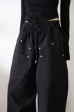 Trimming rivet over pants