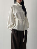 High-neck belted balloon-fit blouse