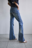 TWISTED BOOTS CUT DENIM JEANS