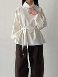 High-neck belted balloon-fit blouse