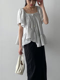 Prin Unbalanced Flare Blouse