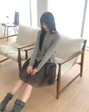 Nilla cut-out round neck button long-sleeved cardigan