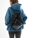 Metallic panel drawstring backpack