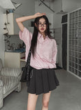 String striped over short-sleeved shirt
