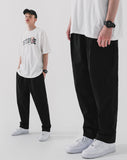 Deep tuck loose fit tapered banding pants