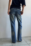 TWISTED BOOTS CUT DENIM JEANS