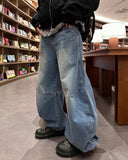 Curved washed darts denim