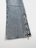 Sage cross lace denim pants