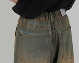 Glossy coated wide jeans