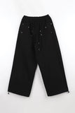 Trimming rivet over pants