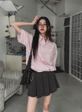 String striped over short-sleeved shirt