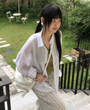 Any loose fit gauze see-through shirt