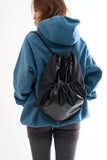 Metallic panel drawstring backpack