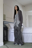 String ribbon over pants