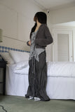 String ribbon over pants