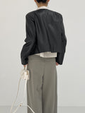 Modern collarless short leather jacket
