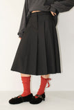 CUT-OFF PLEATS MIDI SKIRT