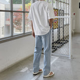 Half-bending semi-wide denim pants