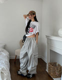 Land semi-crop over short sleeves