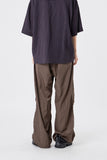 Out string glossy banding pants