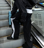 Oblique side zipper nylon pants