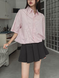 String striped over short-sleeved shirt