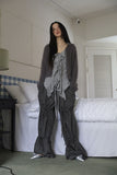 String ribbon over pants