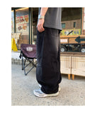 Ete diagonal curve denim pants