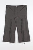 String ribbon over pants