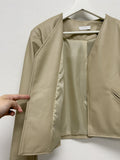 Modern collarless short leather jacket