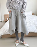 FRONT POCKET UNBAL SKIRT