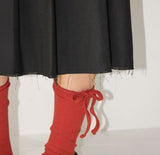 CUT-OFF PLEATS MIDI SKIRT