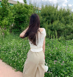 Punching Strap Ribbon Point Crop Short Sleeve Knit