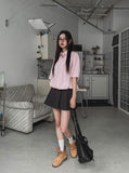 String striped over short-sleeved shirt
