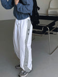 Cross string nylon pants