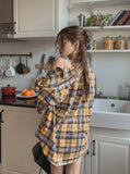Bribe printed over checkered shirt