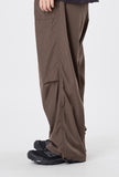 Out string glossy banding pants