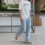 Half-bending semi-wide denim pants