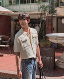 Leviron Two-Pocket Cut-out Collar Short-Sleeve Cardigan